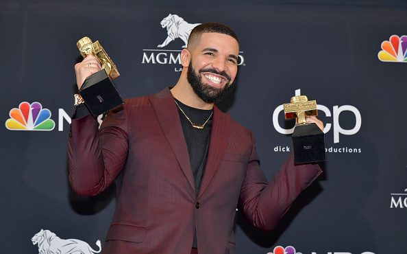 Drake poses with the awards for Top Artist, Top Male Artist, Top Billboard 200 Album for “Scorpio...