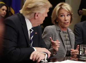 U.S. Secretary of Education Betsy DeVos (R) speaks as President Donald Trump (L) listens during a parent-teacher conference listening session at the Roosevelt Room of the White House February 14, 2017 in Washington, DC. The White House held the session to discuss education. (Photo by Alex Wong/Getty Images)