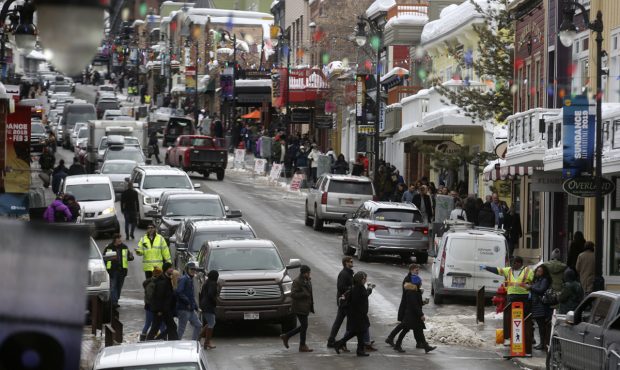 People cross a busy Main Street during the Sundance Film Festival in Park City on Jan. 25, 2019. (K...