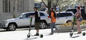 E-scooter renters ride down Main Street in Salt Lake City on Friday, April 19, 2019. (Photo: Steve Griffin, Deseret News)