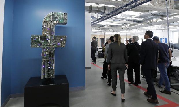 FILE - In this Jan. 9, 2019, file photo, media and guests tour Facebook's new 130,000-square-foot o...