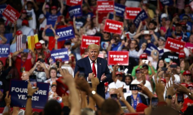President Donald Trump reacts to the crowd after speaking during his re-election kickoff rally at t...