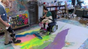 Bingham helps Keyona Eccles paint