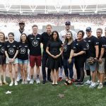 LONDON, ENGLAND - JUNE 29:  Prince Harry, Duke of Sussex and Meghan, Duchess of Sussex pose with members of the Invictus Games Foundation and baseball players before the  Boston Red Sox vs New York Yankees baseball game at London Stadium on June 29, 2019 in London, England. The game is in support of the Invictus Games Foundation. (Photo by Peter Nicholls - WPA Pool/Getty Images)