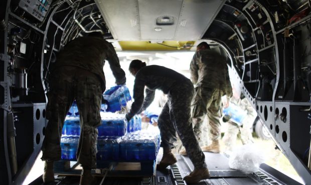 UTUADO, PUERTO RICO - OCTOBER 18: U.S Army soldiers offload bottled water from a helicopter during ...