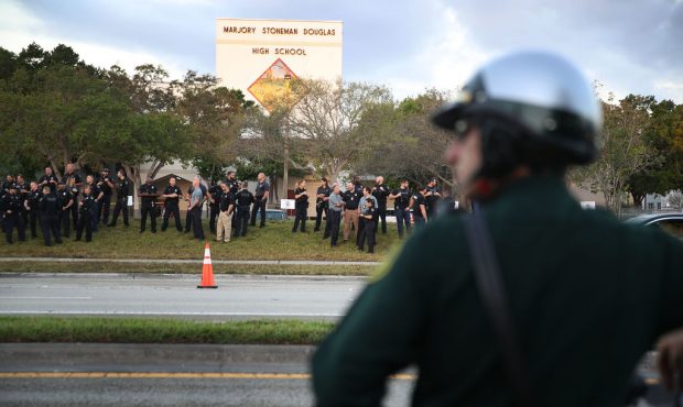 PARKLAND, FL - FEBRUARY 28: Police officers stand in front of Marjory Stoneman Douglas High School ...