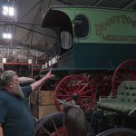 Anderson points to a mercantile wagon, one of nearly 350 he now owns.

