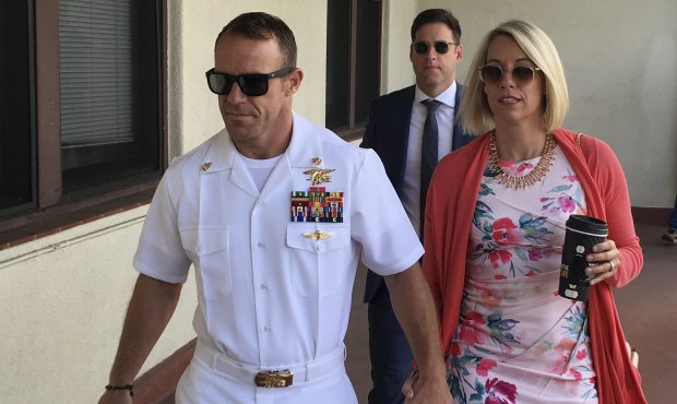 Navy Special Operations Chief Edward Gallagher, left, walks with his wife, Andrea Gallagher as they...