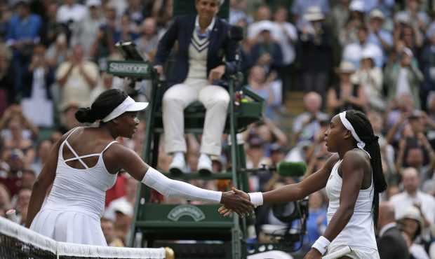 United States' Cori "Coco" Gauff, right, greets the United States's Venus Williams at the net after...