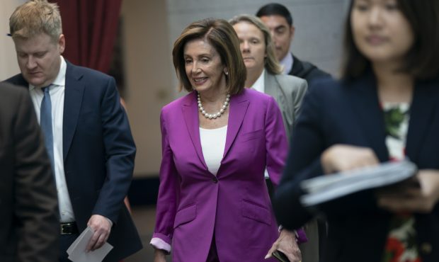 House Speaker Nancy Pelosi, D-Calif., arrives for a closed-door session with her caucus before a vo...
