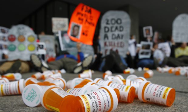 FILE - In this April 5, 2019, file photo, containers depicting OxyContin prescription pill bottles ...