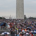 People gather on the National Mall while President Donald Trump gives his speech during Fourth of July festivities on July 4, 2019 in Washington, DC. President Trump is holding a "Salute to America" celebration on the National Mall on Independence Day this year with musical performances, a military flyover, and fireworks. (Photo by Stephanie Keith/Getty Images)