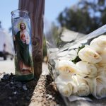 GILROY, CALIFORNIA - JULY 29:  Flowers and a candle sit outside the site of the Gilroy Garlic Festival after a mass shooting there yesterday on July 29, 2019 in Gilroy, California.  Three victims were killed and at least a dozen were wounded before police officers killed the suspect. (Photo by Mario Tama/Getty Images)