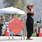 GILROY, CALIFORNIA - JULY 29: A woman stands near a police checkpoint outside the site of the Gilroy Garlic Festival, after a mass shooting took place at the event yesterday, on July 29, 2019 in Gilroy, California.  Three victims were killed, two of them children, and at least a dozen were wounded before police officers killed the suspect. (Photo by Mario Tama/Getty Images)
