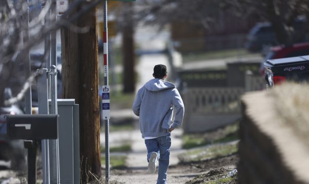 A man runs to the location of a shooting death in Kearns on Monday, March 18, 2019. (Photo: Silas W...