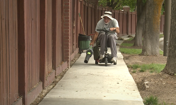 66-year-old Sandy resident Jim Peery blows away some leaves in his neighborhood....