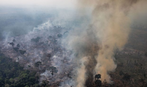 In this aerial image, A fire burns in a section of the Amazon rain forest on August 25, 2019 in the...