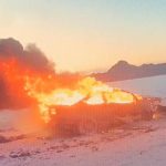 Images from police body camera footage show a car engulfed in flames at the Salt Flats. (Image courtesy Wendover Police Department)