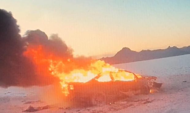 Images from police body camera footage show a car engulfed in flames at the Salt Flats. (Image cour...