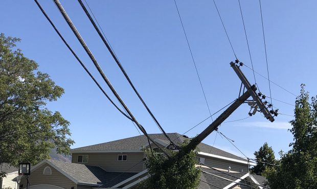 A dump truck snagged communications lines and knocked down at least 8 power poles, according to off...