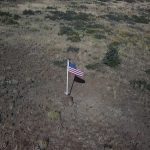 An American flag commemorates the crash site of a WWII plane at Flat Top near Enterprise, Utah.