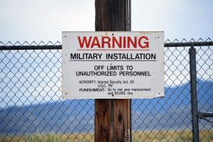 A warning sign is posted at the back gate at the top-secret military installation at the Nevada Test and Training Range known as Area 51 on July 22, 2019 near Rachel, Nevada. (Photo by David Becker/Getty Images)