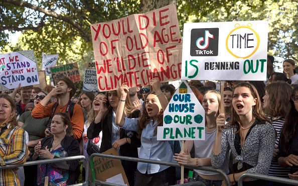 LONDON, ENGLAND - SEPTEMBER 20: Children listen to speakers as they attend the Global Climate Strik...