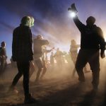 Revelers dance at the 'Storm Area 51' spinoff event 'Alienstock' on September 20, 2019 in Rachel, Nevada. The event is a spinoff from the original 'Storm Area 51' Facebook event which jokingly encouraged participants to charge the famously secretive Area 51 military base in order to 'see them aliens'.  Two tiny desert towns not far from from the once-secret Area 51 are hosting related events this weekend. The military has warned attendees not to approach the protected Area 51 military installation.  (Photo by Mario Tama/Getty Images)