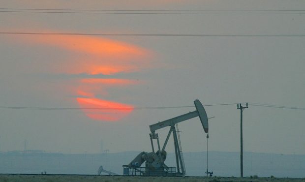 FILE: The sun sets behind an oil derek near the Saudi Arabian border. (Photo by Joe Raedle/Getty Im...