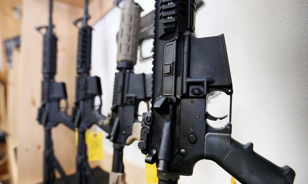 AR-15 semi-automatic guns are on display for sale at Action Target in Springville, Utah. (Photo by ...