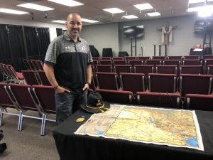 Bryan Catherman stands next to a table of memorabilia from his time in the military serving in Anbar. He’s now a pastor at Redeeming Life Church in Salt Lake City.