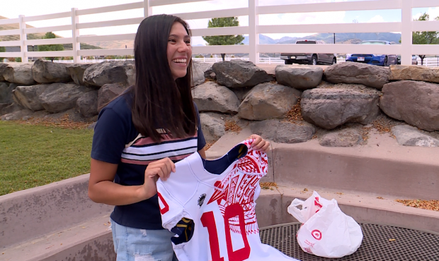 Peyton Bisquera shows off her jersey from the year she played girls football and suffered a concuss...