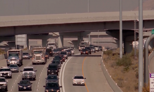 Vehicles travel on I-15 in Salt Lake County...