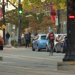 Schwarz rides his bike down Main Street in Salt Lake City.