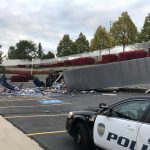 The driver of a semi truck was taken to the hospital in serious condition after the truck crashed over a retaining wall and into a church parking lot in Sandy on Oct. 10, 2019. (Photo: Felicia Martinez)