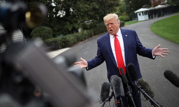 U.S. President Donald Trump answers questions while departing the White House on October 03, 2019 i...