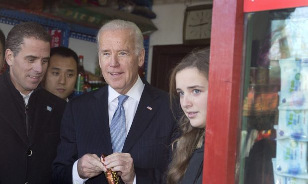 FILE: Former U.S. Vice President Joe Biden, center, his granddaughter Finnegan Biden, right, and so...