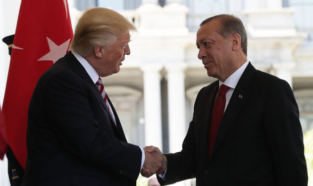 FILE: U.S. President Donald Trump (L) welcomes President Recep Tayyip Erdogan (R) of Turkey outside...