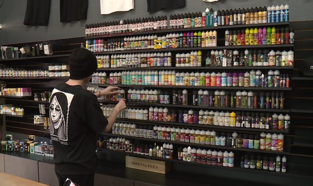 A customer looks at e-liquid flavors at Rebel Goat Vapors....