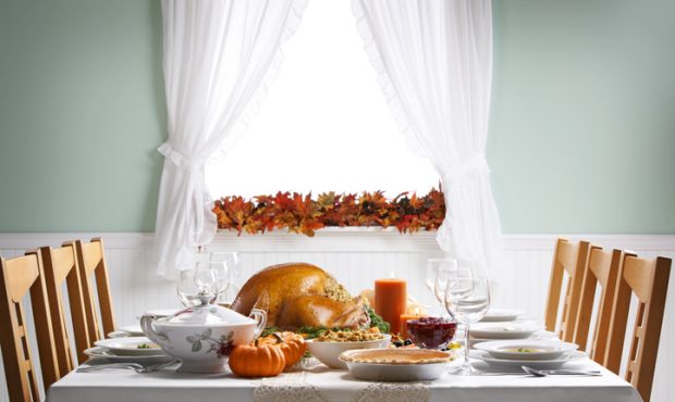 A Thanksgiving turkey sits ready to be carved for a Thanksgiving Day feast on a festively decorated...