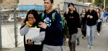 Students are escorted out of Saugus High School after the shooting. (Marcio Jose Sanchez / AP)