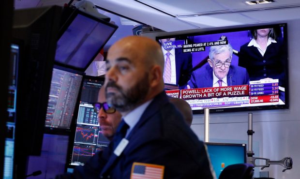 A television screen on the floor of the New York Stock Exchange shows Federal Reserve Chair Jerome ...