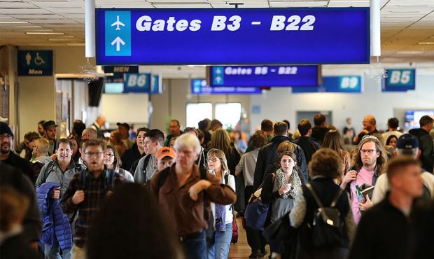 FILE: Travelers at the Salt Lake City International Airport. (Photo by George Frey/Getty Images)...