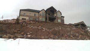 Bennett and Kassie Thurgood told KSL in February 2017 that the retention wall of their Ogden property collapsed in April 2016. Concerned for their safety, the family moved out about six months later. (Photo: Steve Breinholt, KSL TV – February 2017)
