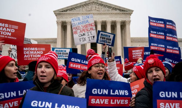 Gun safety advocates rally in front of the U.S. Supreme Court before during oral arguments in the S...