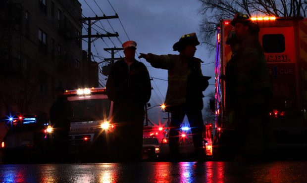 JERSEY CITY, NJ - DECEMBER 10: Emergency personnel are shown on the scene of a shooting that left m...