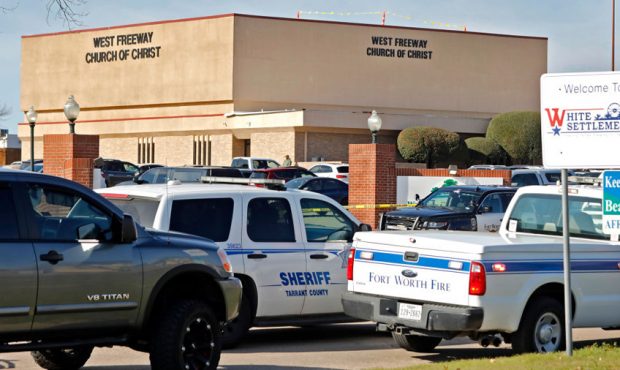WHITE SETTLEMENT, TX - DECEMBER 29: Law enforcement vehicles are parked outside West Freeway Church...