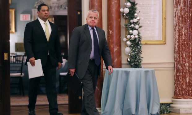 Deputy Secretary of State John Sullivan (R) walks into the Ben Franklin Room ahead of a joint news ...