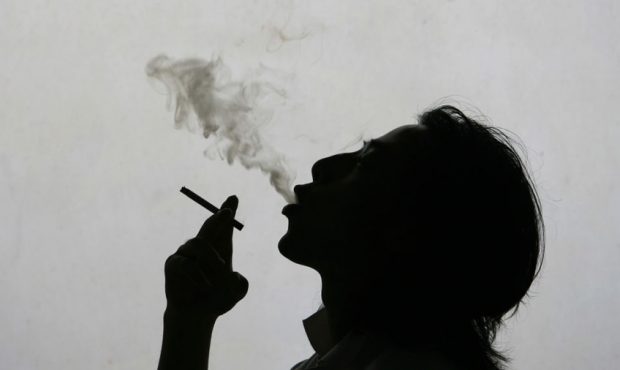FILE: In this photo illustration a man exhales smoke whilst smoking a cigarette.(Photo by China Pho...