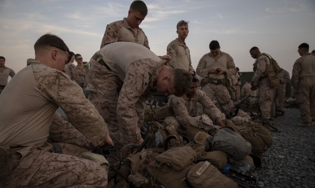 U.S. Marines prepare to deploy from Kuwait in support of a crisis response mission, Dec. 31, 2019. ...